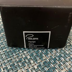 PHILIPPI Equipe traveler desk clock. Leather and steel, zip closure
